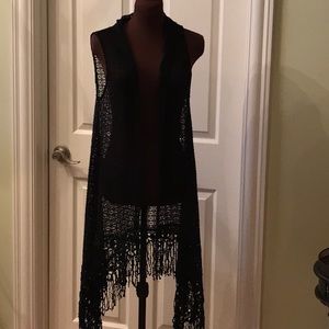 Black lace vest with fringe.